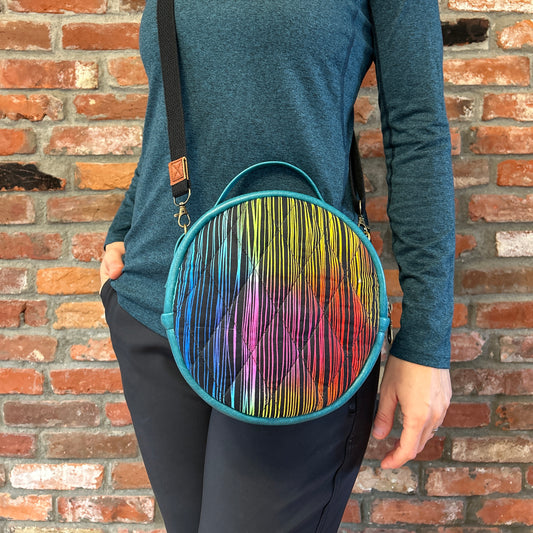 Sun Sewn Round Blue Rainbow Stripes Crossbody Bag